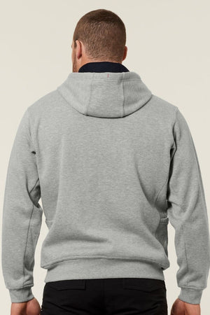 A person is seen from the back wearing a light gray Hard Yakka Plain Fleece Hoodie and black pants against a plain light background.