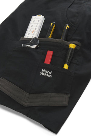 The Hard Yakka Raptor Mid Short includes a black pocket for tools like a tape measure, box cutter, and screwdriver. It features reinforced stitching in contrasting colors and an Active Fit stretch waistband for comfort and flexibility.