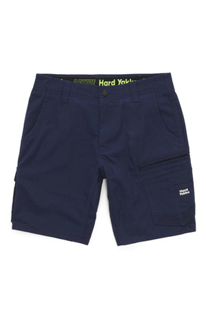 The Hard Yakka Raptor Mid Short is a navy blue men’s work short with multiple pockets, including zippered and flap options on the right leg. It features an Active Fit stretch waistband with "Hard Yakka" branding on the pocket and inner waistband.