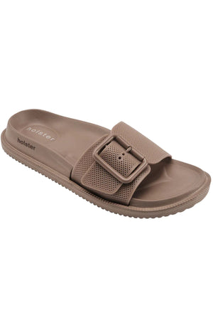 Holster Laze: A single taupe vegan sandal featuring a water-resistant textured sole, wide perforated strap, large matching buckle, and "holster" branding on the footbed.
