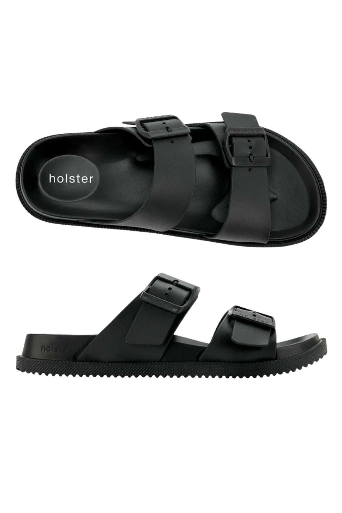 The Holster Soleseeker is a pair of black vegan slip-on sandals with two adjustable buckle straps, flat ridged soles, and "holster" branding on the insole, shown from the top and side views.