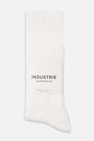 A 2-pack of comfortable Industrie Crew socks, ribbed and folded together with a white label wrapped around them showing the brand name “INDUSTRIE AUSTRALIA.”.