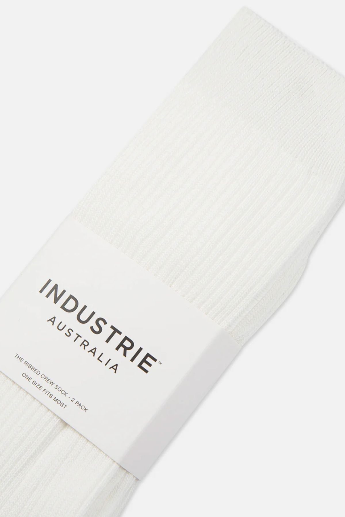 A close-up of comfortable white ribbed Industrie Crew Sock 2pk, packaged with a white label reading "INDUSTRIE AUSTRALIA – The Ribbed Crew Sock, 2 Pack, One Size Fits Most.