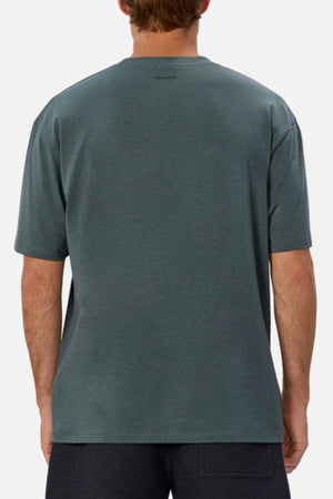 A person wearing an Industrie The Freeman Athletic Tee and dark athletic shorts is posed with their back to the camera against a plain background, subtly highlighting the Industrie branding.
