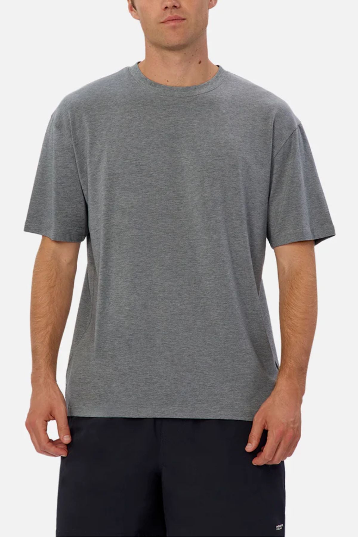 A person wearing the Industrie The Freeman Athletic Tee in plain gray and dark shorts stands against a light background, facing forward with arms relaxed at their sides.
