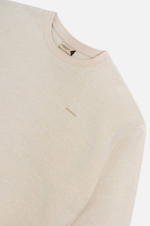 The Tech Del Sur Sweat by Industrie is a beige crewneck sweatshirt with a subtle embroidered "INDUSTRIE" logo on the chest, made from breathable fabric for all-day comfort, shown against a plain white background.