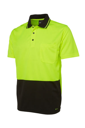The JBs Hi Vis Non Cuff Traditional Polo is a 100% polyester shirt with a bright yellow-green top, black bottom, collar detailed with thin white stripes, button placket, and a handy chest pocket.
