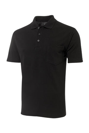 The JBs Pocket Polo is a plain black, regular fit short sleeve shirt with a collar, three buttons, and a small chest pocket. Made from soft polyester cotton, it’s shown on a white background.