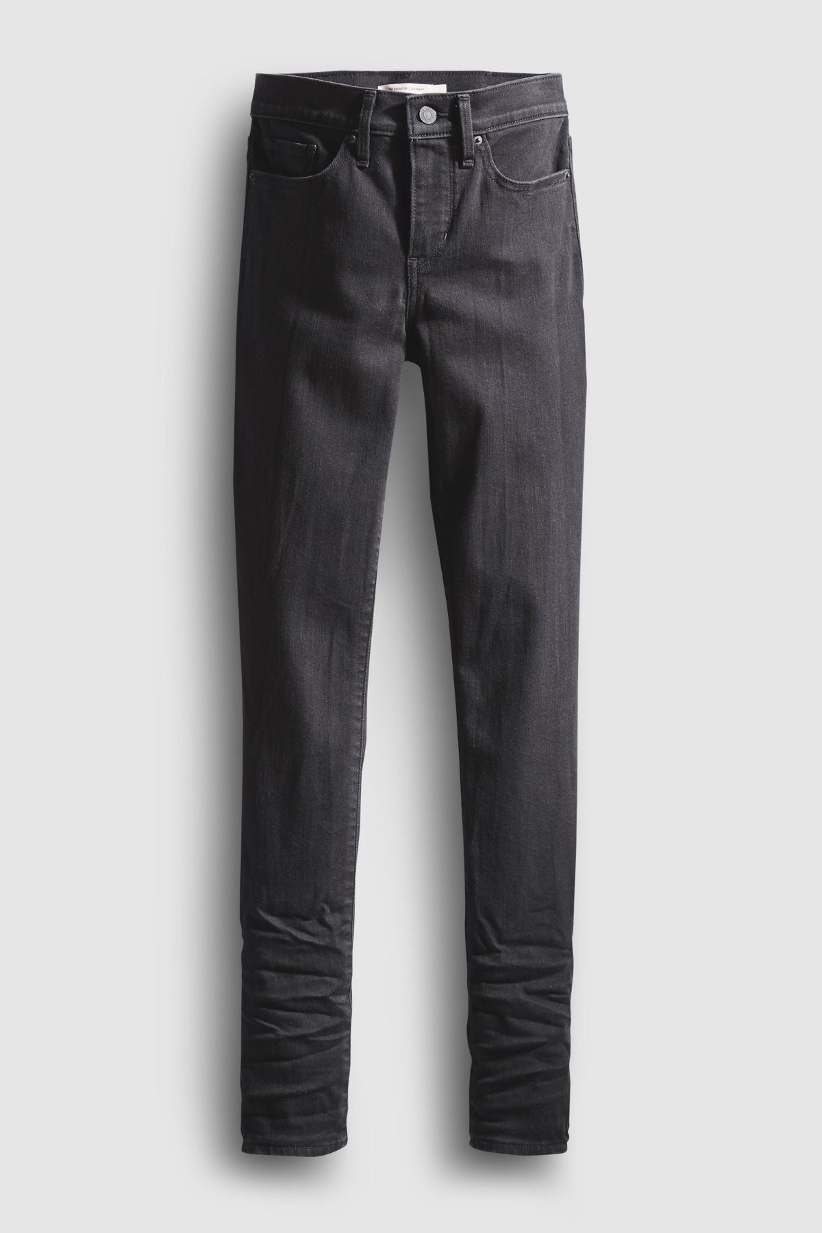 A pair of Levis 311 Shaping Skinny Jeans in classic black, featuring front and back pockets with a button and zipper closure, displayed on a plain light background.
