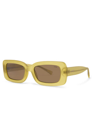 Liive Crush Sunglasses feature yellow rectangular frames, brown tinted lenses, and a polycarbonate build providing UV protection. The smooth frames have subtle temple branding and embody a minimal, glossy look that's reminiscent of vintage 90s style.