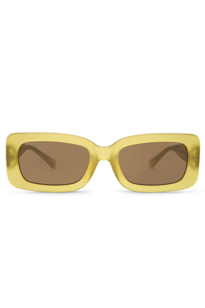 The Liive Crush Sunglasses feature a yellow polycarbonate frame with brown lenses offering UV protection, styled as vintage 90s rectangular shades. Photographed head-on against a plain white background, they blend retro aesthetics with modern durability and flair.