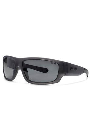 The Liive Exile Polar Sunglasses are black wraparound shades with dark polarised lenses, matte finish, thick sturdy frames for UV protection, and the βLIIVEβ brand name on the left arm.