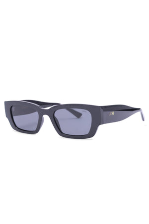 The Liive LOBster Sunglasses sport rectangular black frames and UV-protected dark lenses. Lightweight polycarbonate temples feature gold "LIIVE" branding. Angled on a white background, they are both stylish and protective.