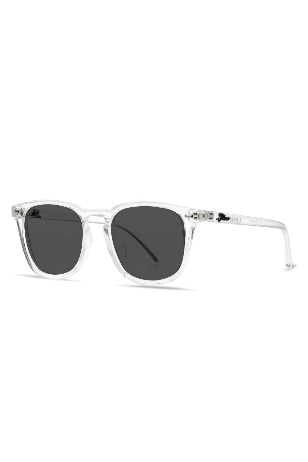 Introducing the Liive Manhattan Polar Sunglasses: a pair of stylish eyewear featuring clear, transparent frames and dark, rectangular polarized lenses. The sleek design is further enhanced by its transparent arms. Expertly crafted from lightweight polycarbonate, these sunglasses offer UV protection and are presented against a plain white background.
