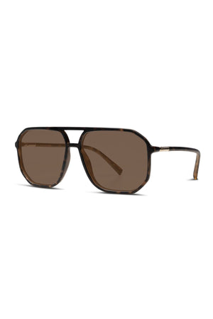 Liive Nia Sunglasses feature a thin tortoiseshell aviator frame, dark brown lenses, a double bridge, and matching slim arms for a stylish look.