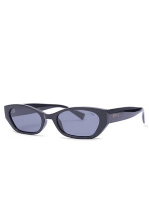 The Liive Tobes Polarised Sunglasses feature a black semi-cat-eye frame, tinted lenses, and "LIIVE" printed on the temples. Made from lightweight polycarbonate, they offer UV protection and are showcased on a white background.