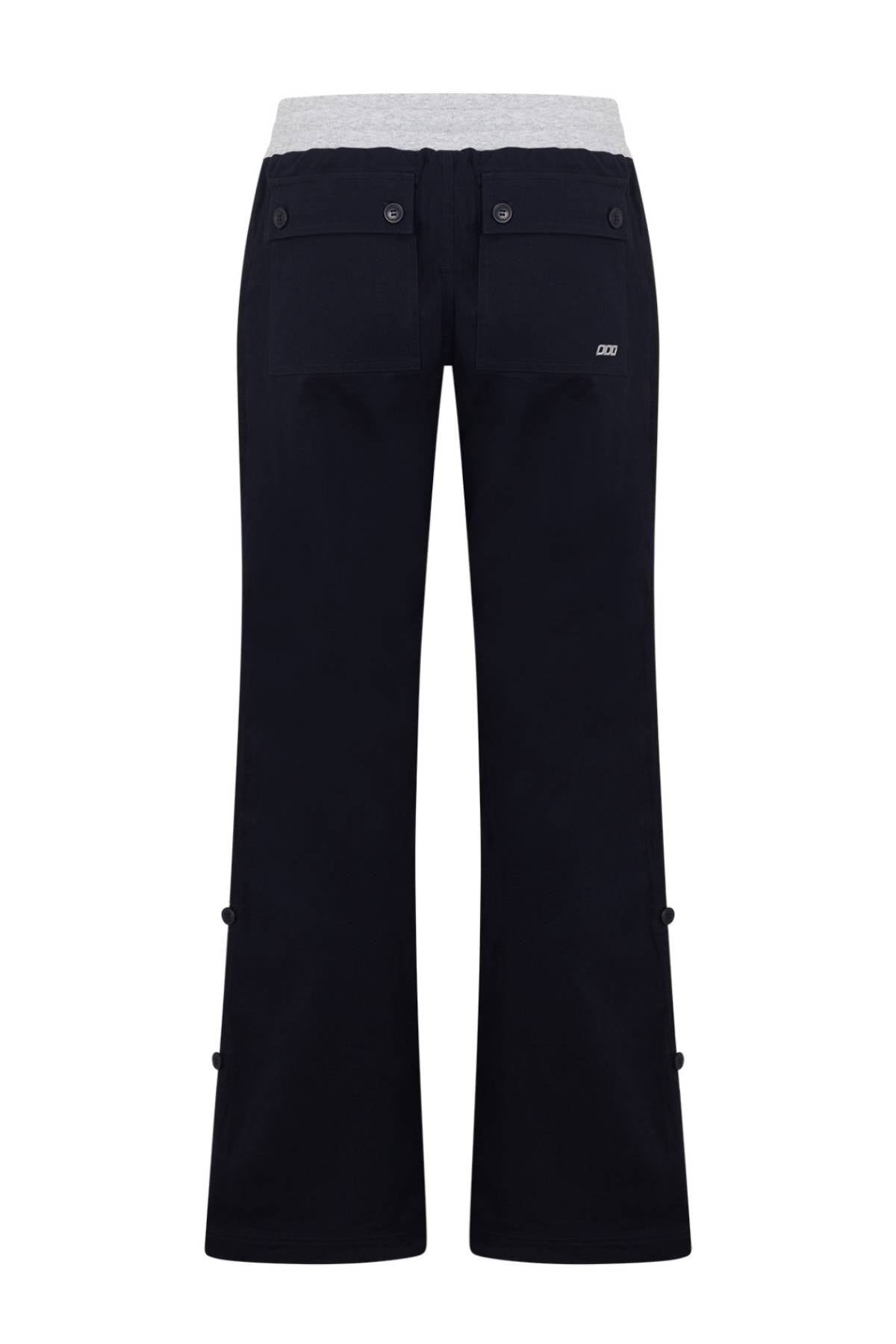 Rear view of the Lorna Jane Flashdance Work Pant in black, featuring two buttoned back pockets and a light gray waistband.