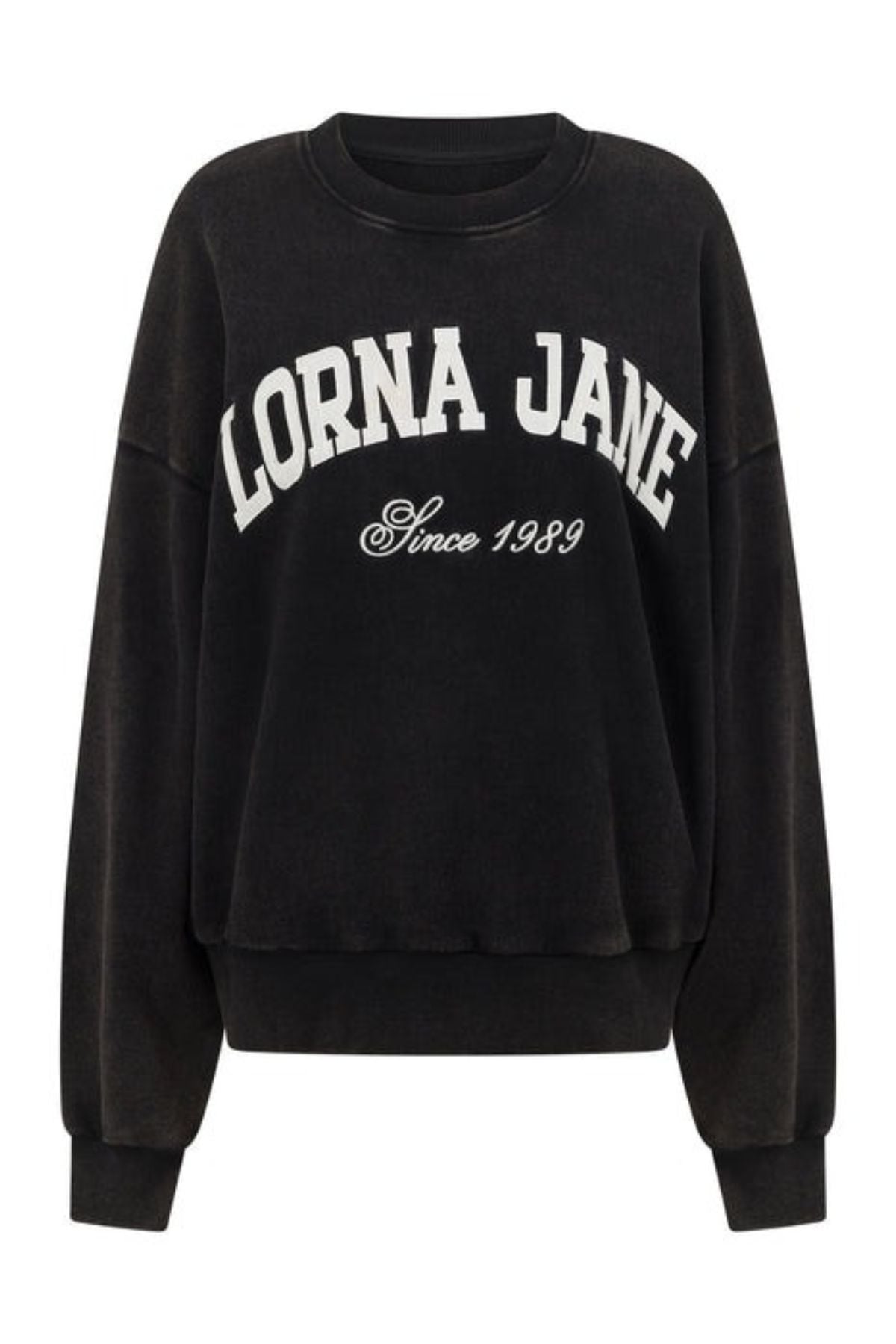 The Lorna Jane New Sport Washed Sweatshirt is a black, vintage-inspired oversized fit, featuring "LORNA JANE" in bold white lettering and "Since 1989" below, crafted from soft cotton terry.