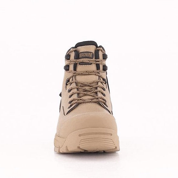 Front view of a tan Magnum Precision Max Zip Sided Waterproof Safety Boot MPN150. The boot is equipped with sturdy laces, metal eyelets, a reinforced safety toe cap, and a thick, high-traction outsole designed for rugged terrain. The logo "MAGNUM" is prominently displayed on the tongue above the laces.