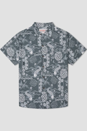 The Mr Simple Koi Bowler Short Sleeve Shirt is a short-sleeved, button-up top featuring a dark gray background adorned with an intricate white floral and fish pattern, including detailed designs of flowers, leaves, and koi fish. The collar inside the shirt sports a small label reading "Holiday.
