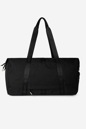 The Mr Simple Nelson Duffle is a large black bag with sturdy handles, "QUALITY GOODS" text, and a trolley sleeve, shown against a plain white background.