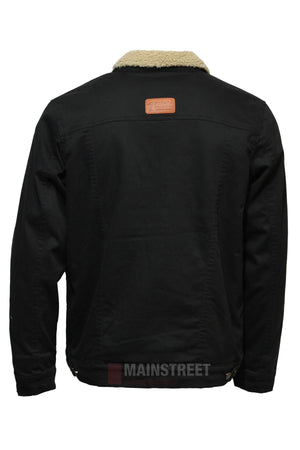 Back view of the Pilbara Canvas Sherpa Lined Jacket in black, featuring a light beige sherpa collar, long sleeves with buttoned cuffs, adjustable waist tabs, and a brown leather patch on the upper back. Inspired by outdoor adventure.