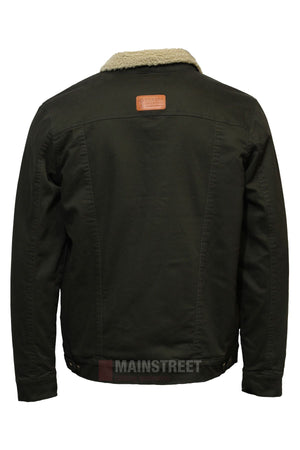 The Pilbara Canvas Sherpa Lined Jacket, shown from the back, features a black denim look with a light brown shearling collar, small brown leather patch on the upper back, adjustable waist buttons, and warm sherpa lining.