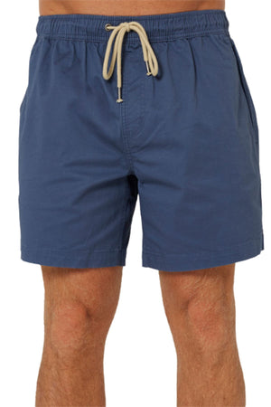 A person wearing Pilbara Cotton Stretch Shorts in blue with a beige drawstring and elastic waist, shown from the lower torso to upper legs against a plain white background.