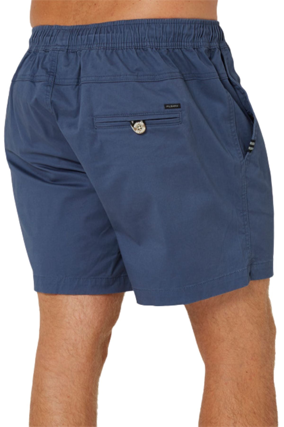 A person wearing Pilbara Cotton Stretch Shorts with an elastic waist and back pocket, photographed from the waist down and viewed from behind.