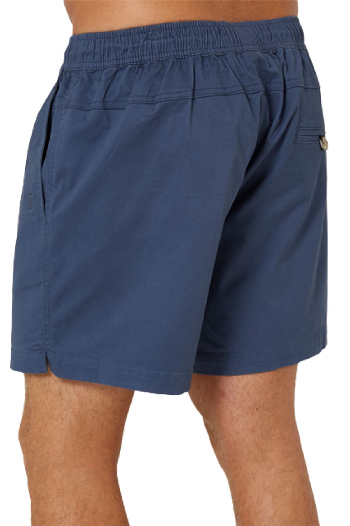 A person wearing blue Pilbara Cotton Stretch Shorts with an elastic waistband, shown waist to mid-thigh from the back, highlighting the side and back pocket details.
