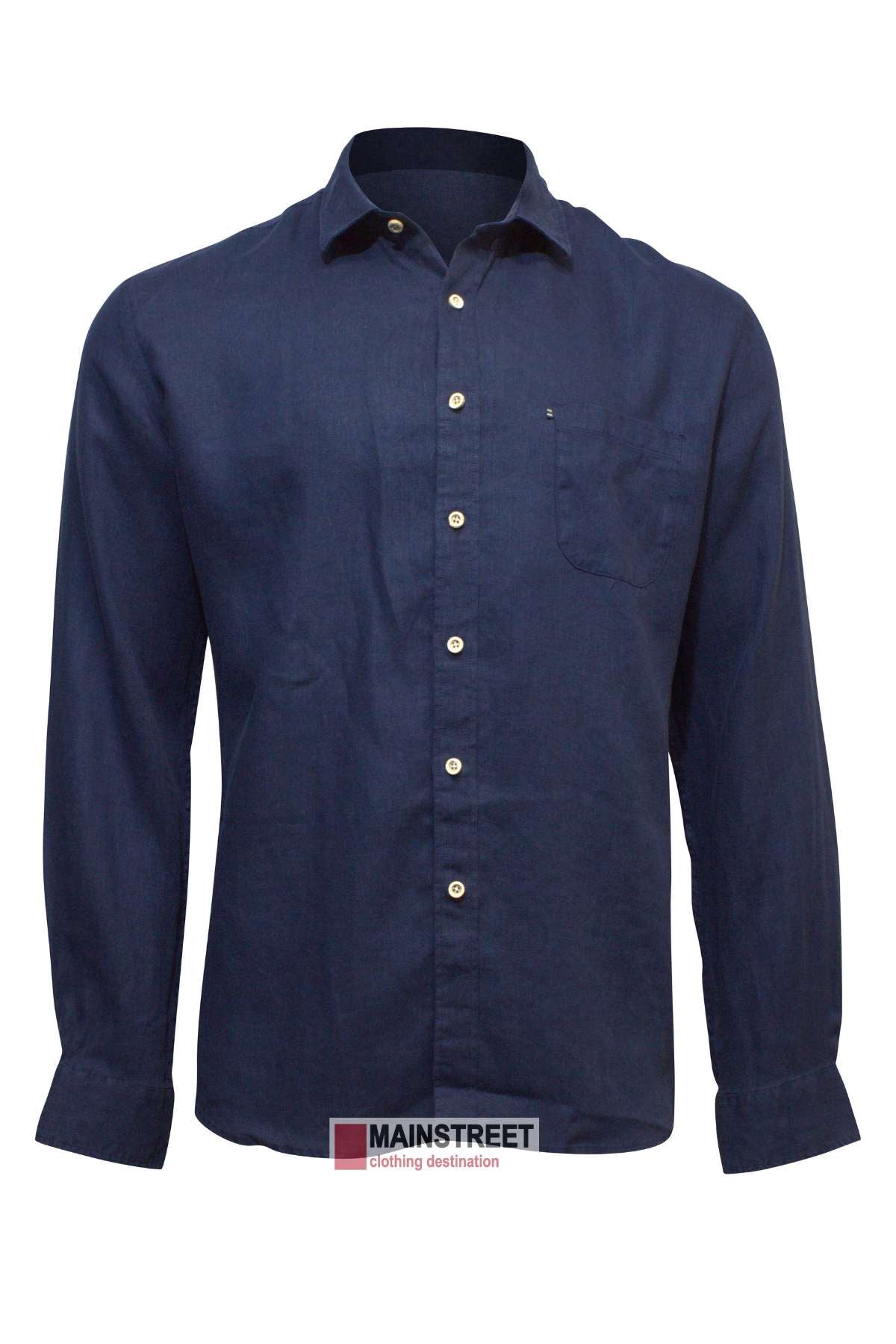 A long-sleeved, dark blue Pilbara Linen Shirt featuring a single chest pocket and white buttons. The shirt is displayed on a white background, placed in front of a label that reads "MAINSTREET clothing destination.