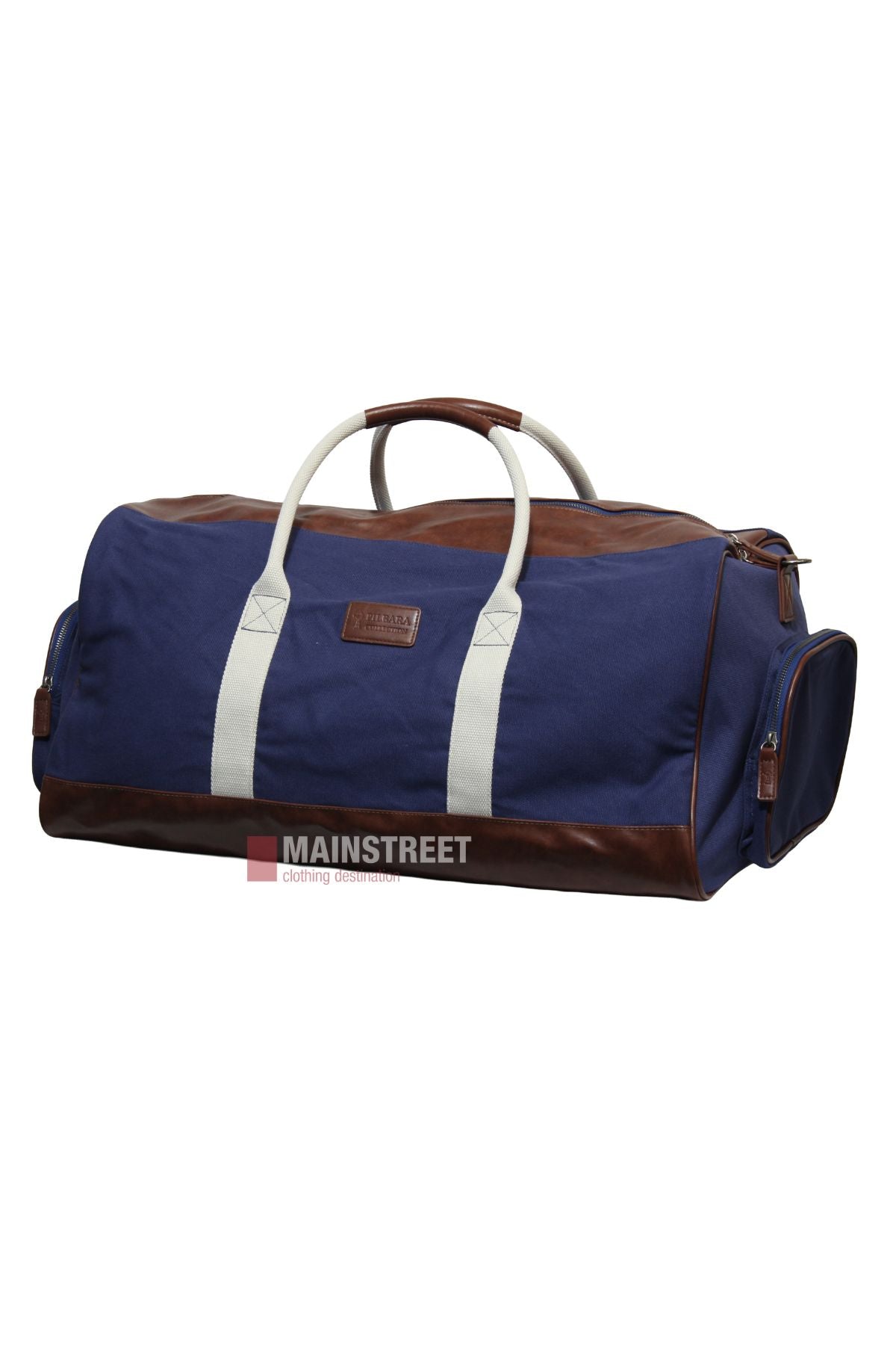 The Pilbara Long Weekender Bag is a blue canvas and leather travel bag with brown leather accents, white handles, and side pockets. It features a rectangular shape and a front patch, shown against a white background.