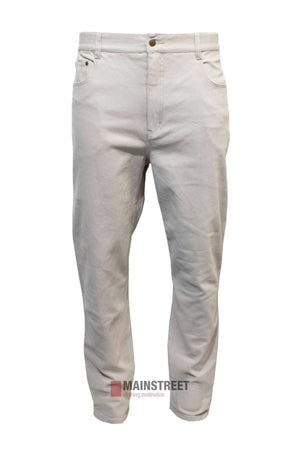 The Pilgrim Moleskin Jean is a pair of light beige men’s trousers in a regular fit with front and back pockets, visible seams, belt loops, and made from comfortable stretch moleskin fabric. Displayed on a white background.