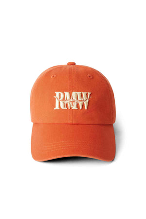 Orange RM Williams Steers Head Cap in cotton twill, featuring a curved brim, off-white embroidered "RMW" logo on the front, ventilation holes on top, and an adjustable strap at the back for comfort.