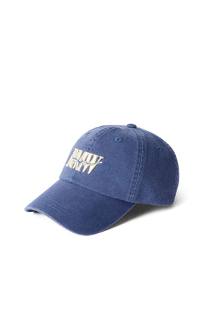 The RM Williams Steers Head Cap is a blue cotton twill cap with white embroidered front text, a curved brim, and visible stitching, shown against a plain white background.