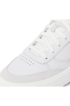 Close-up of the toe and laces of the Reef Bom Dia Shoe, a white sneaker with perforated details, smooth leather and suede finish, and a cushioned footbed for all-day comfort.