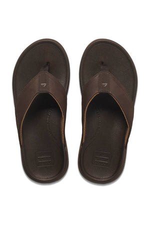 A pair of REEF Cushion Norte men's flip-flop sandals with wide brown straps and textured soles, featuring EVA foam cushioning, displayed side by side on a white background.