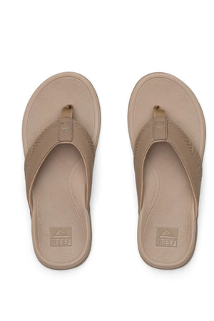 A pair of brown REEF Offshore sandals with textured soles and wide straps, viewed from above. "Reef" is embossed on the footbeds and straps, highlighting their comfortable memory foam design.
