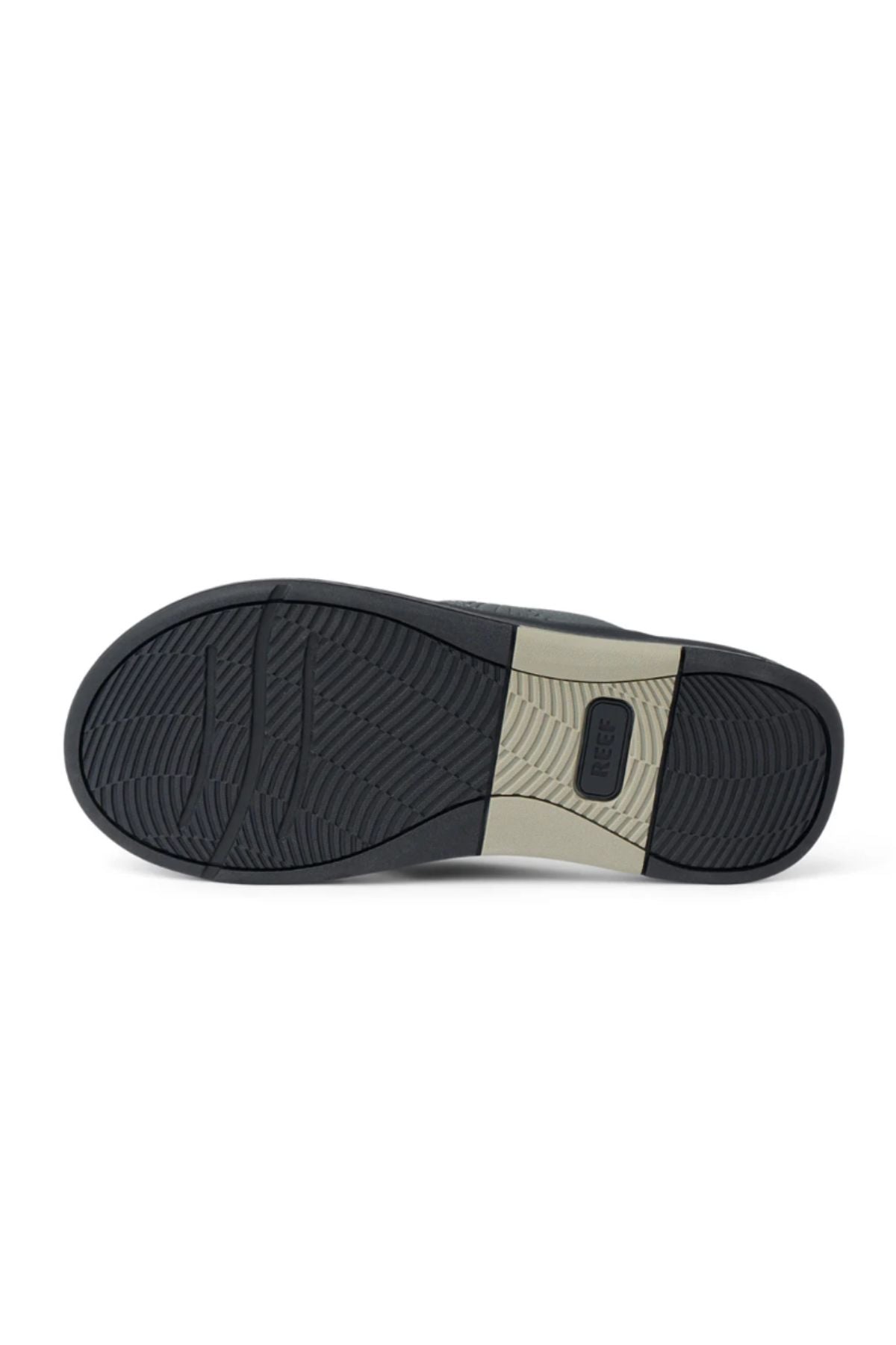 The image shows the sole of the REEF Offshore shoe, featuring a black and beige color scheme with textured grip patterns, arch support details, and a rectangular section embossed with "REEF" at the center of the beige area.