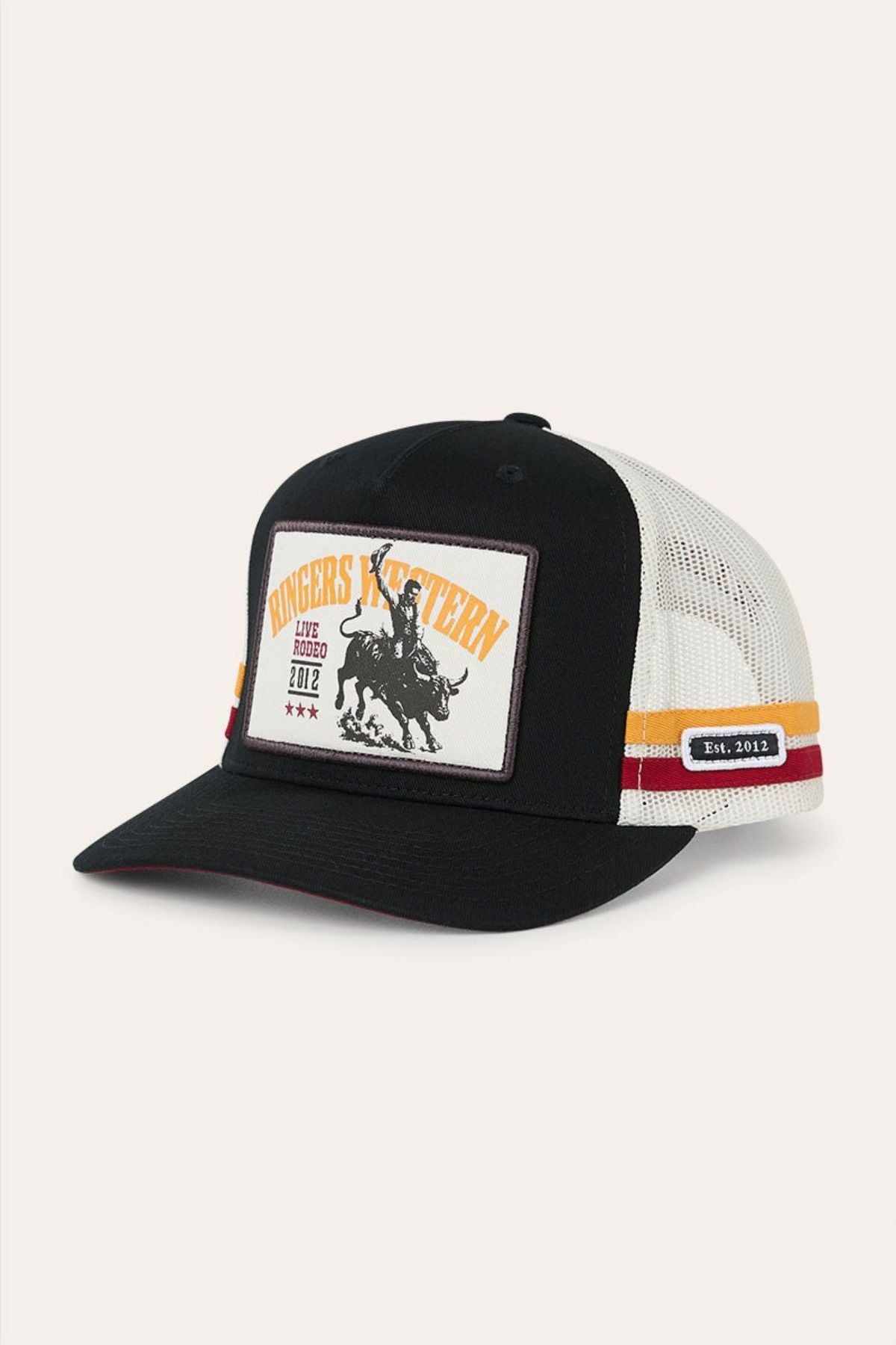 The Ringers Western Live Rodeo Deep Fit Trucker Cap features a classic black and white design with a patch embroidered with “Ringers Western,” a bronco rider, orange stripes, small stars, and “Est. 2012” on the brim—perfect for anyone wanting to channel authentic rodeo style.