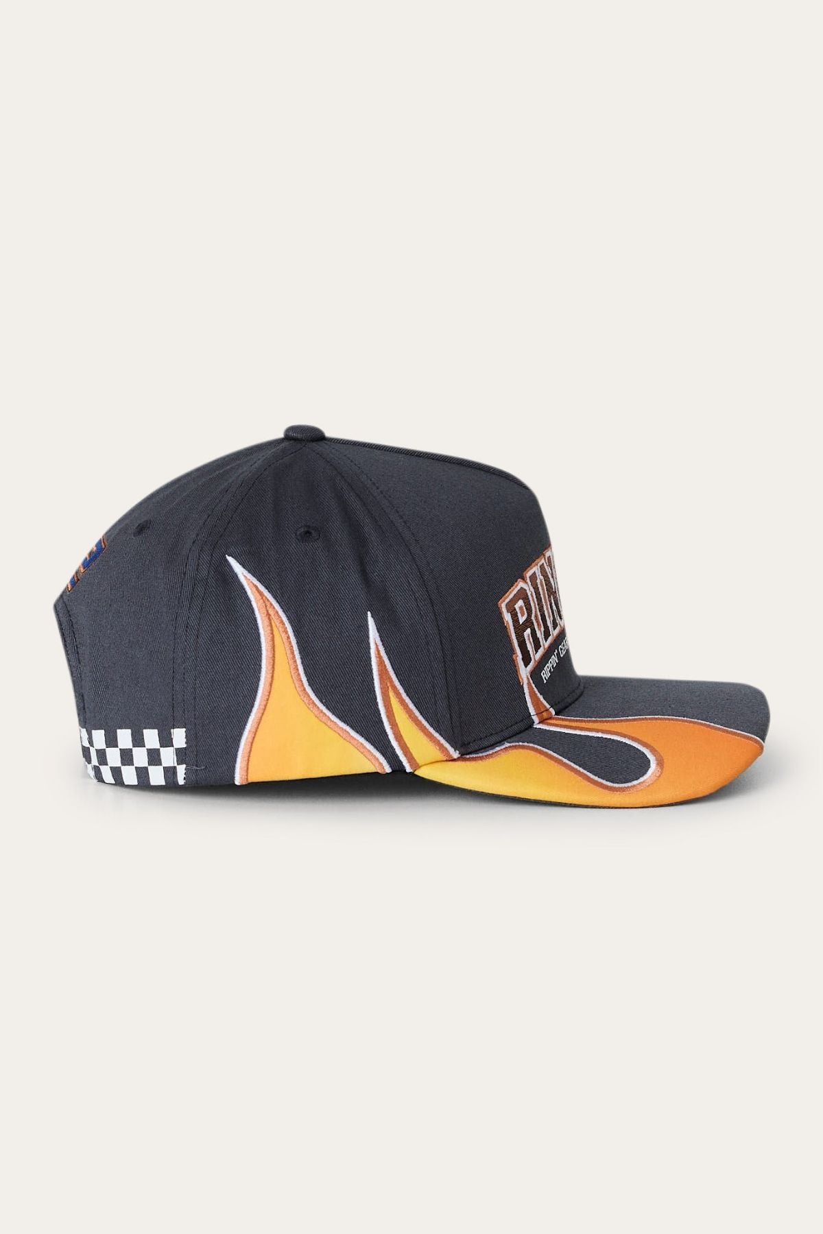 Ringers Western Ringers Racing Baseball Cap features a bold black design with vivid orange and yellow flames along the side and brim, a checkered detail near the back, and a prominent “Rivits” patch on the front—ideal for anyone who loves Ringers Western style.