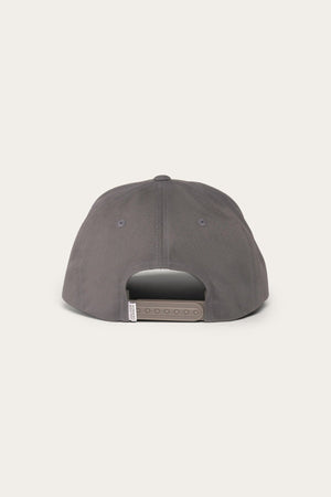 The image shows the back view of a dark grey Ringers Western Rye Baseball Cap made from Cotton Twill. The cap features a snapback closure with multiple adjustment holes. The plain, light-colored background provides a nice contrast to the hat.