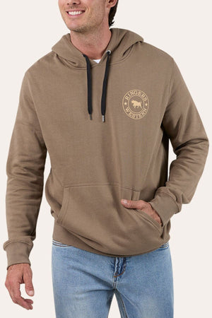 A man wears the Ringers Western Signature Bull Pullover Hoodie, a comfy fleece with a black drawstring, front pocket, and circular bull logo on the chest, paired with light blue jeans.