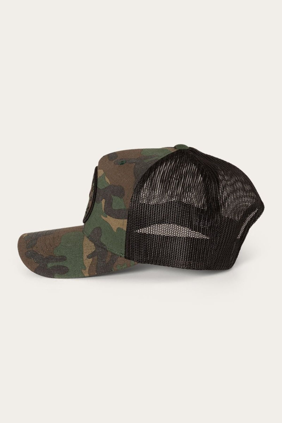 The Ringers Western Signature Bull Trucker Cap, featuring a camouflage pattern, black mesh back, snapback closure, and curved brim, is displayed on a neutral background.