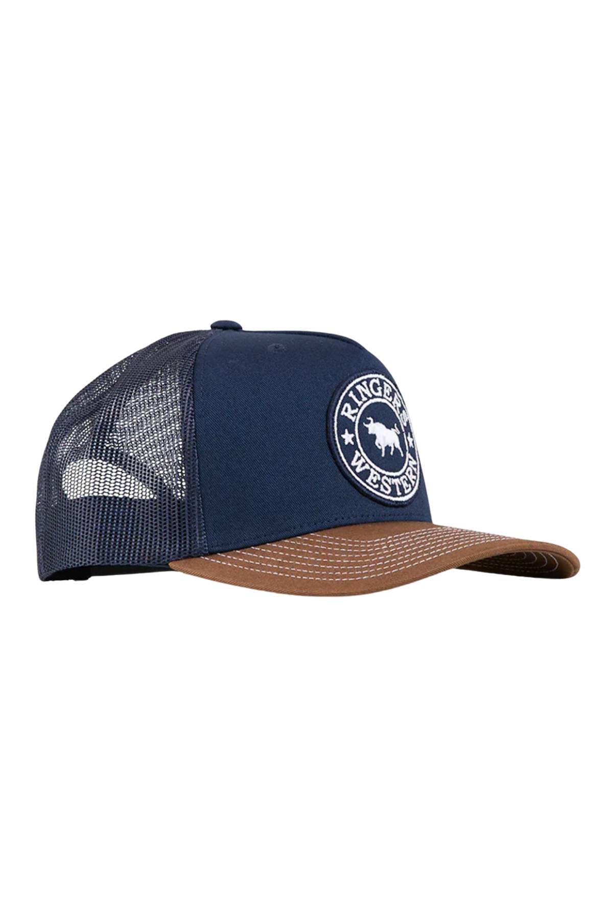 The Ringers Western Signature Bull Trucker Cap features a navy blue front, brown curved brim, mesh back, adjustable strap, and a circular "Ringers Western" bull patch on the front.