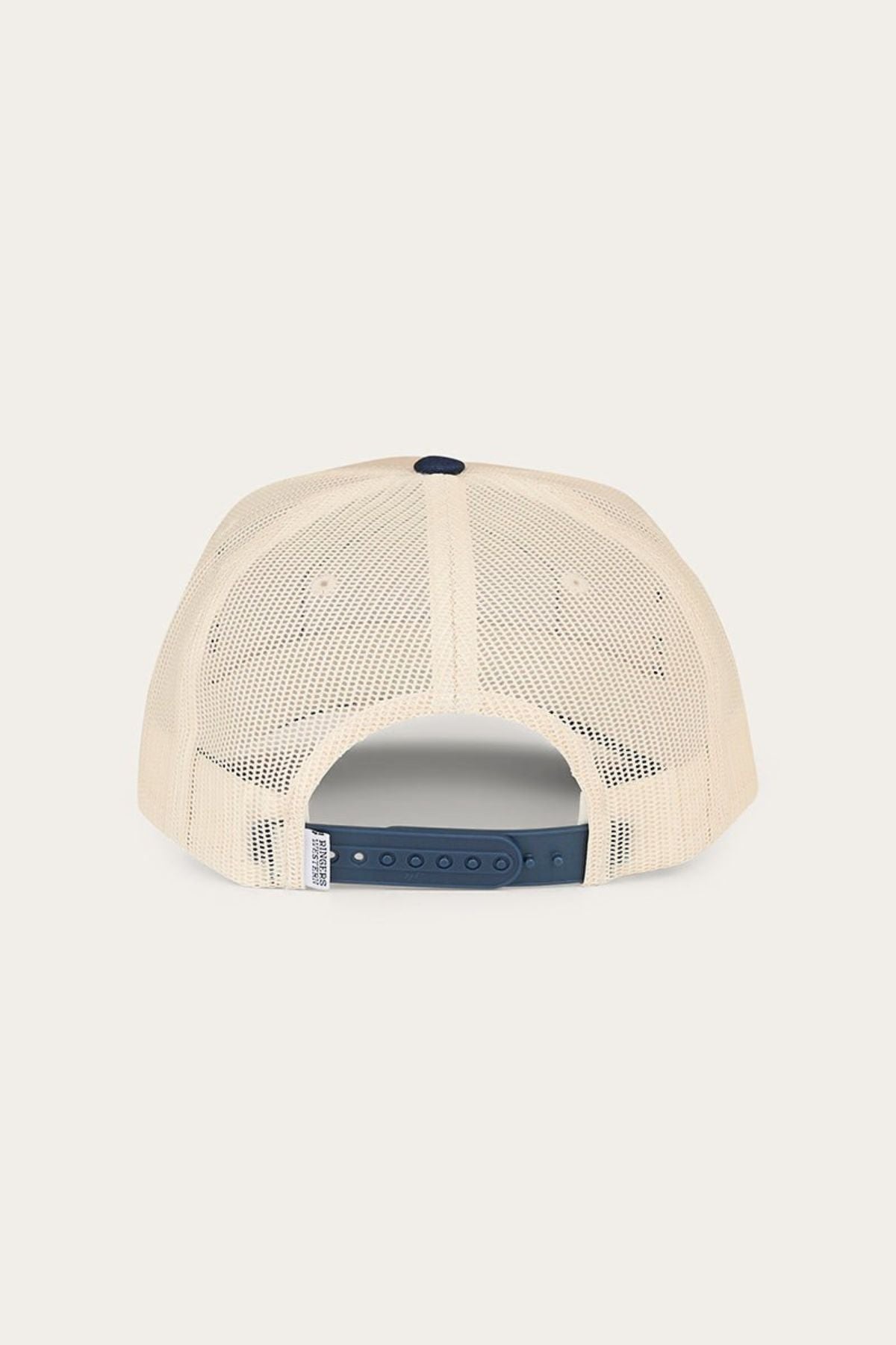 Rear view of the Ringers Western Wheatbelt Trucker Cap in beige, showcasing a breathable mesh-back design and an adjustable navy blue snapback strap closure.
