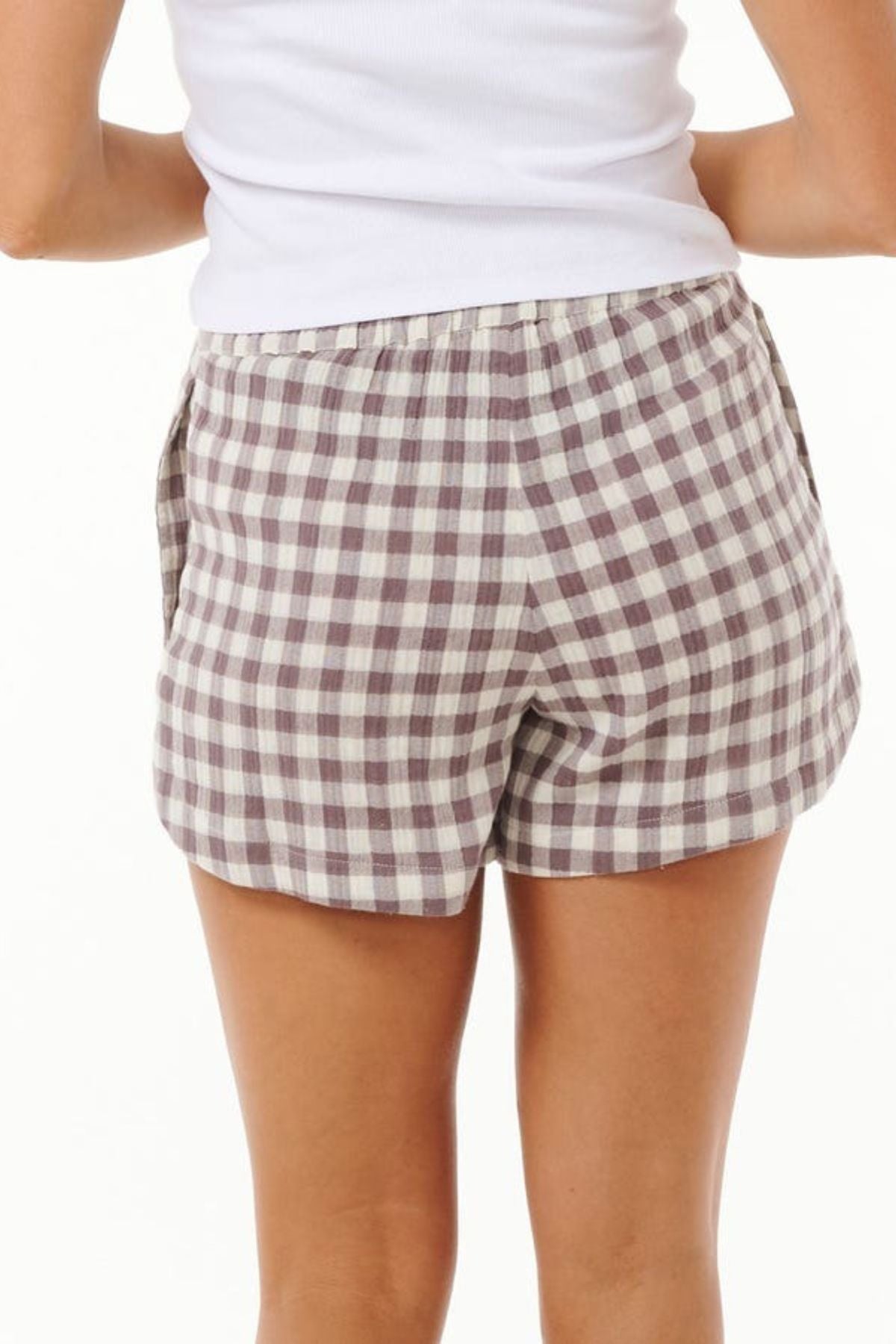 A person wearing a white tank top and the Rip Curl Premium Surf Check Short stands against a plain background, seen from the back.