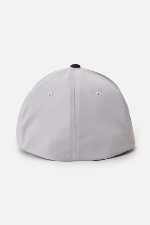 The Rip Curl Routine Flexfit Trucker baseball cap is displayed from the back, showcasing its light gray color with two small ventilation holes and a central black button on top. Ideal for any outdoor enthusiast, this cap is set against a plain white background.