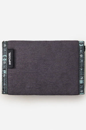 A black Rip Curl Archive Cord Surf Wallet featuring a textured surface and patterned edges, shown closed against a plain white background.