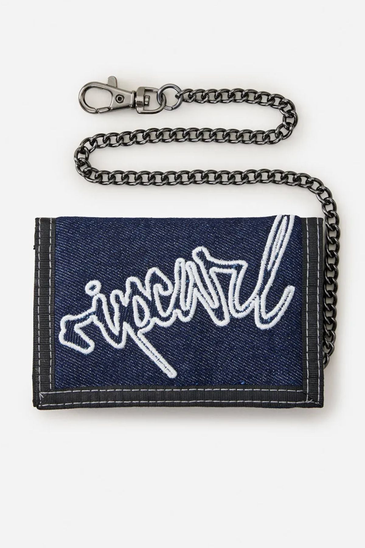 The Rip Curl Archive Denim Surf Wallet is a blue wallet with a white embroidered logo, dark trim, and an attached metal chain. Stylish and practical, itβs perfect for everyday surf-inspired adventures. Displayed on a white background.